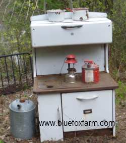 Antique Wood Cook Stove - see what it looks like now, as a display for some junk gardening vignettes...