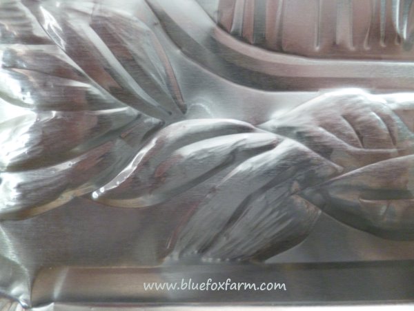 Close  up view of the simple leaf shapes, outlined on one side, filled on the other...