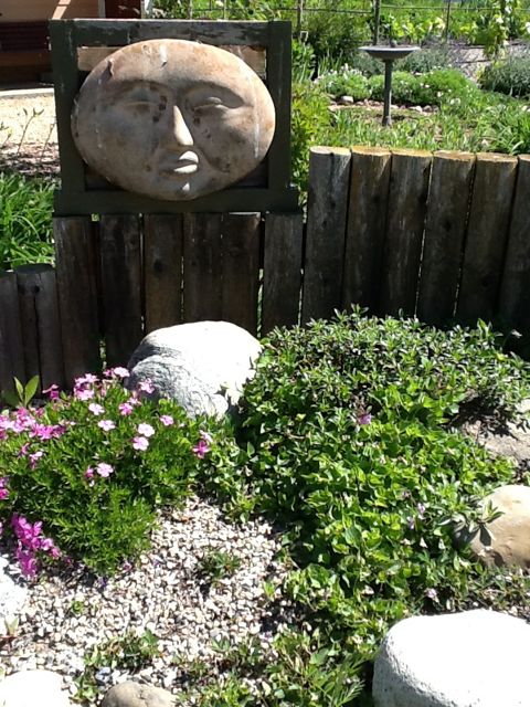 See the gravel garden with this moon face watching over...