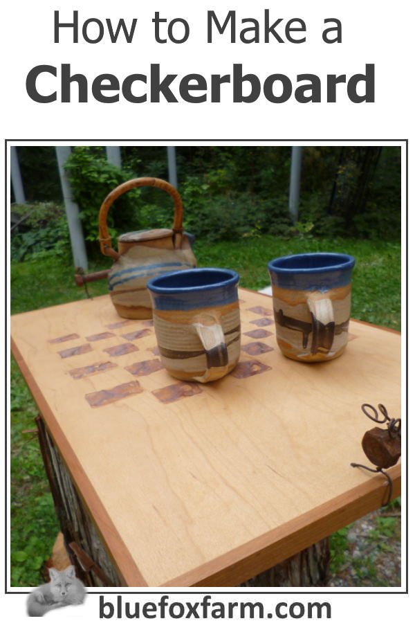 a checkerboard with handmade pottery on it