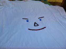 paint a scarecrow face on an old t-shirt