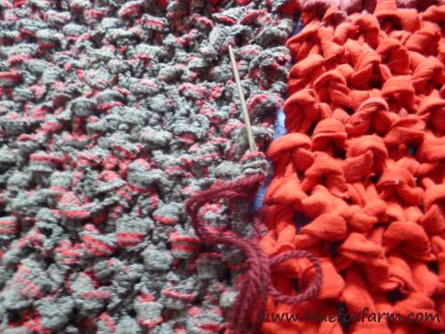 The long knitted pieces are sewn together with yarn and a tapestry needle...