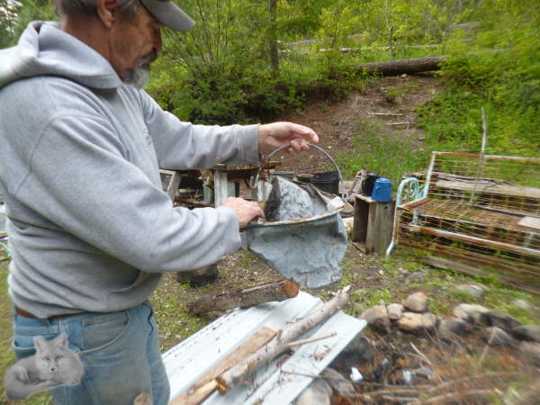 Inspecting the old bucket to see where to hit it next