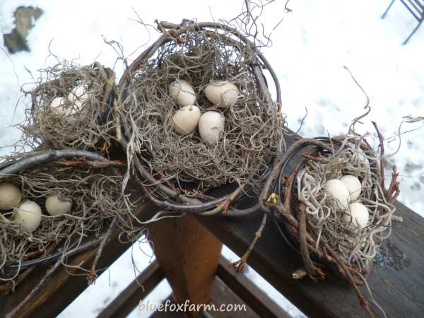 Tiny twig and wire birds nests, complete with 'eggs'...