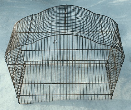 A real bird cage, meant to hold a finch or canary captive...