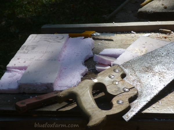 Cutting the rough shape of the chimney with a carpenters saw or serrated blade