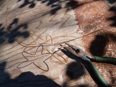 Twist the ends together, and make pigtails on the sharp ends