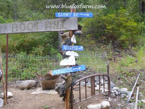 The cloud shape signs added to the sign post at Boot Hill