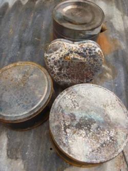 Give tin cans and decorative tins a rusty patina of age