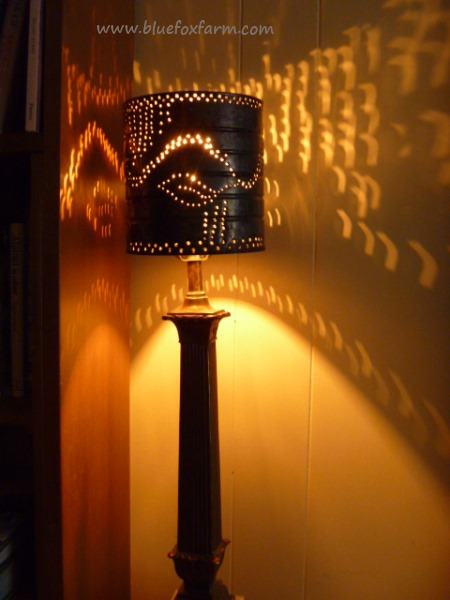 The effect of the way the light shines through a punched tin lampshade is magical