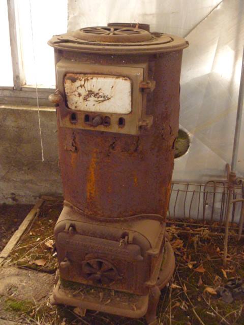 Really Rustic Wood Stove in a greenhouse