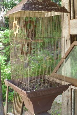 Cherub in a bird cage