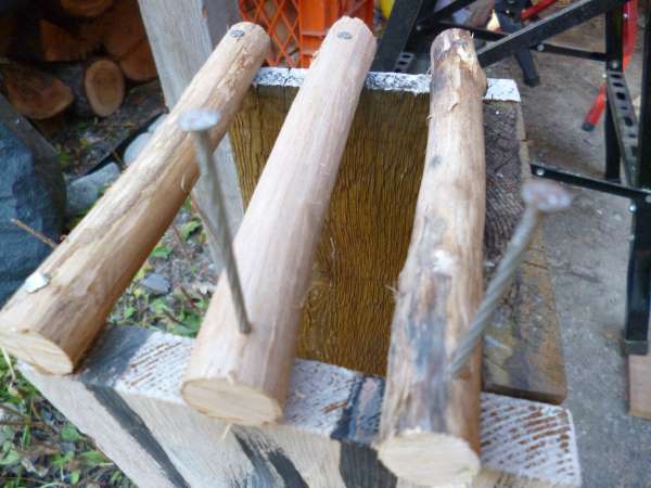 Pre-drill pilot holes in the twigs before nailing