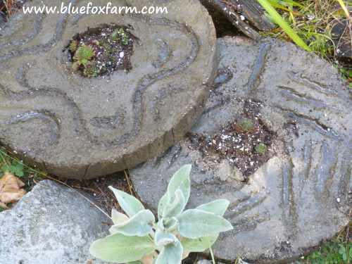 Two hypertufa millstones...