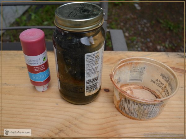 Supplies for making Weathered Red Barn Paint - Giggle Juice, Holiday Red Acrylic Craft Paint, a container and a paint brush, not shown.